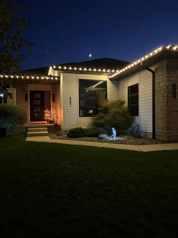 Close-up of evenly spaced Christmas lights along the entry roofline of a home in the Hillcrest area of Lincoln, NE